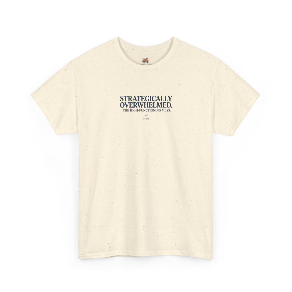 Beige t-shirt with text 'STRATEGICALLY OVERWHELMED' on a white background