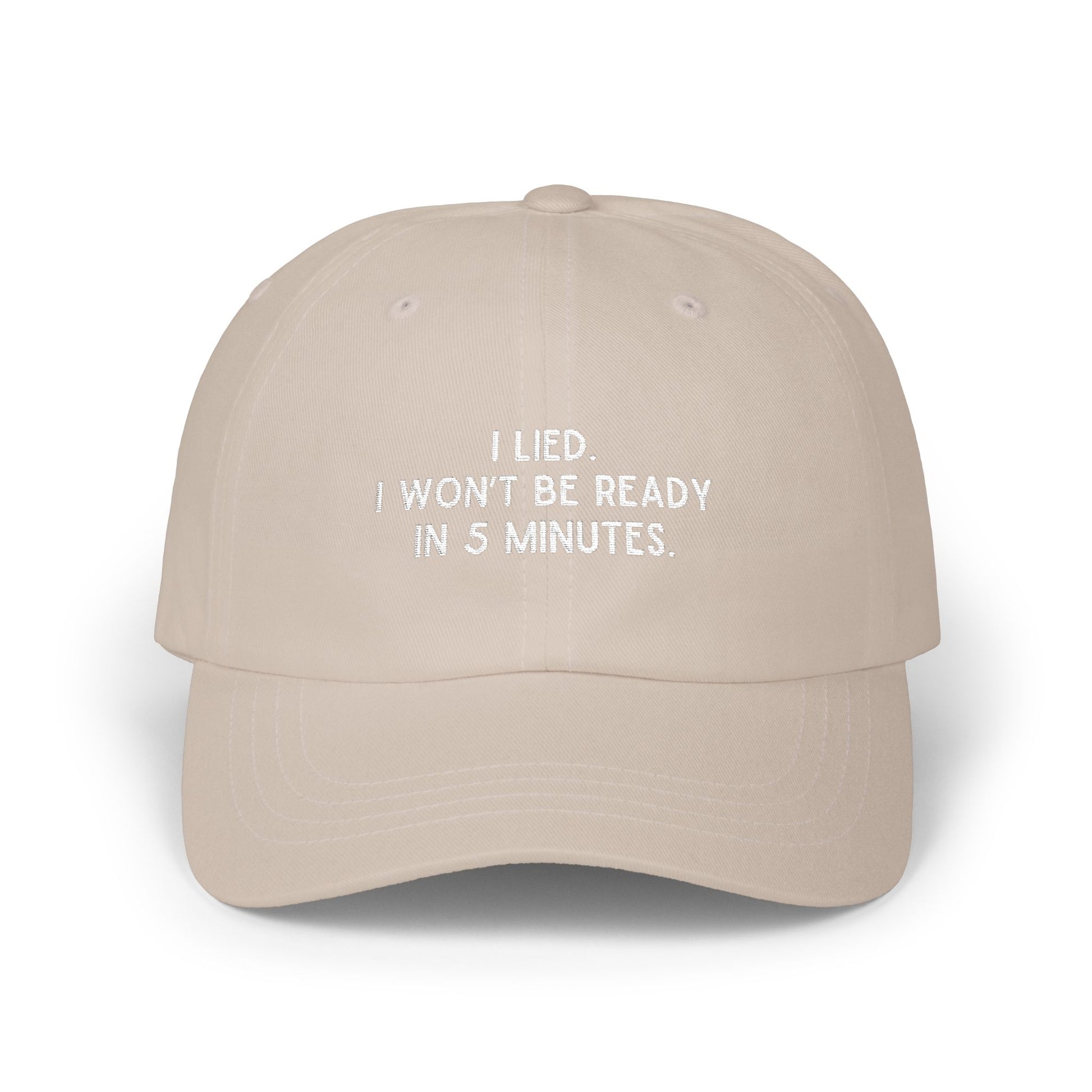 Front view of beige text embroidered dad hat reading I Lied I wont be ready in 5 minutes