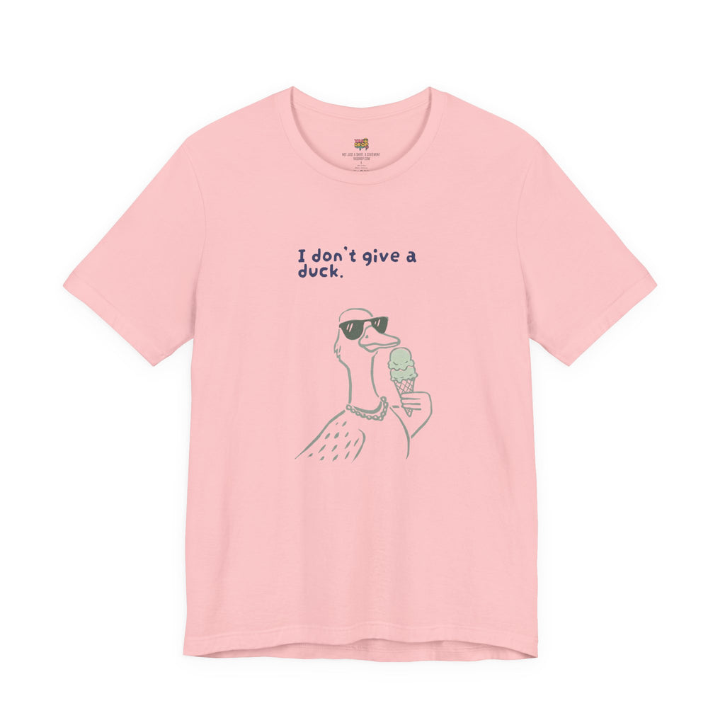 Pink t-shirt with a graphic of a duck wearing sunglasses and holding an ice cream, with text 'I don't give a duck.'