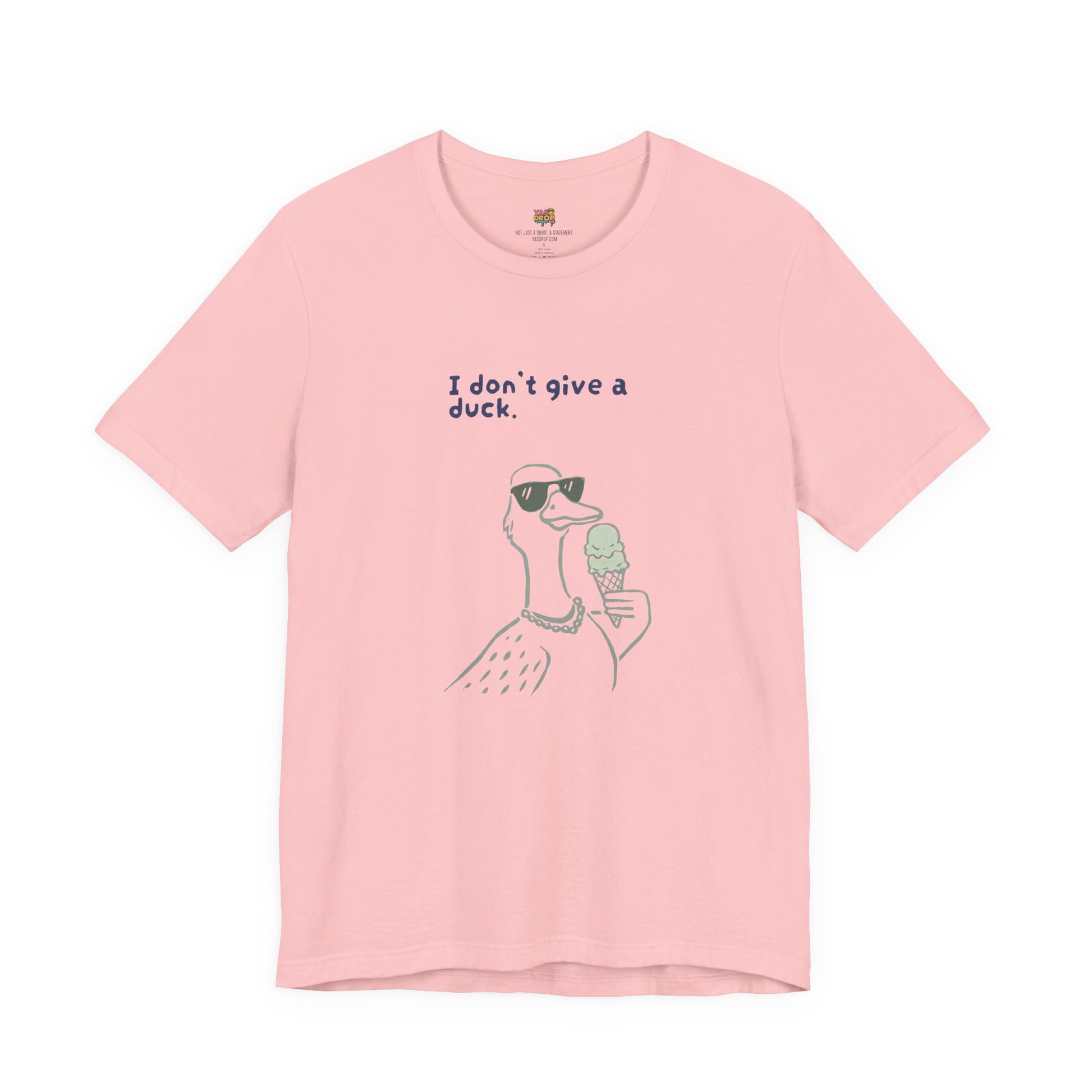 Pink t-shirt with a graphic of a duck wearing sunglasses and holding an ice cream, with text 'I don't give a duck.'