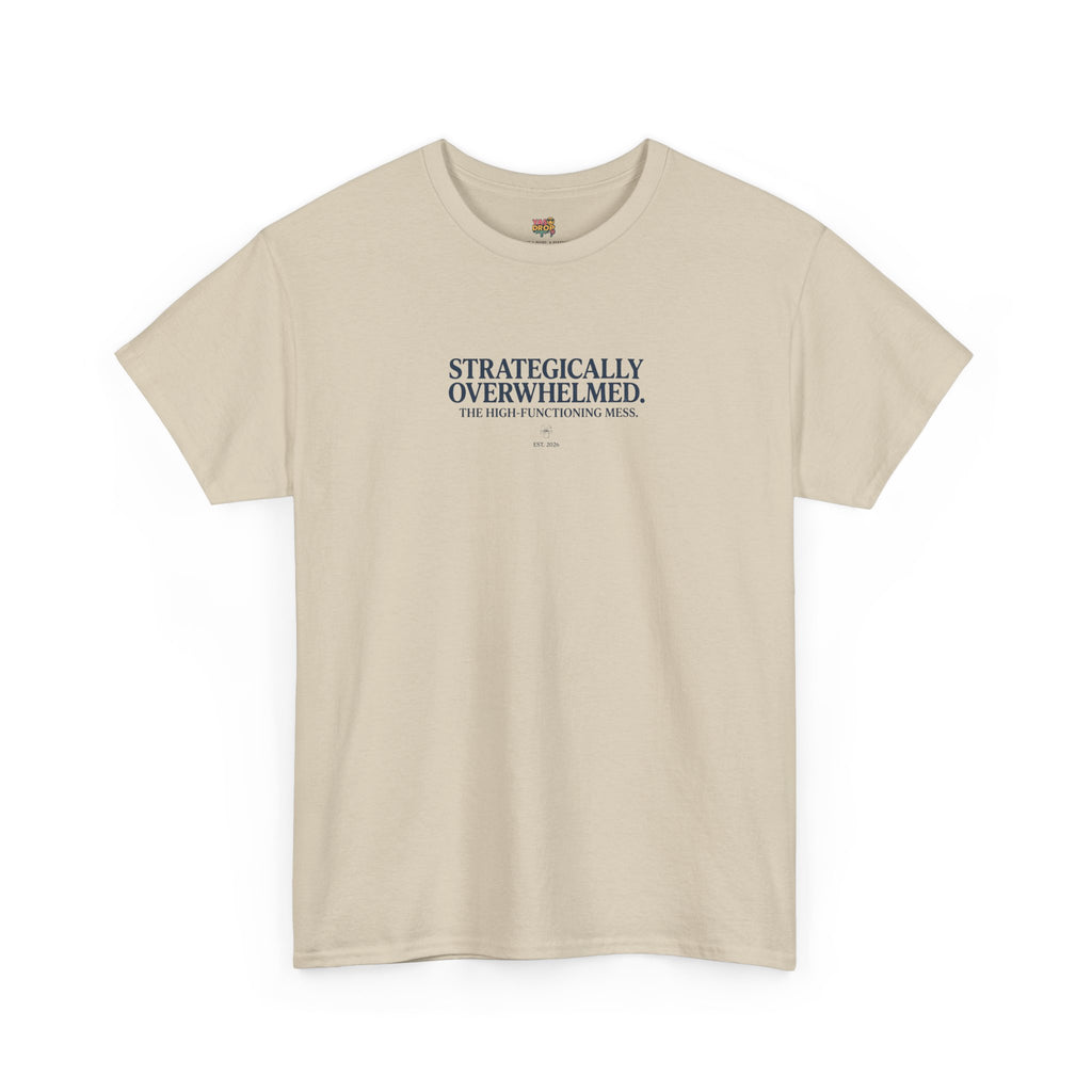 Beige t-shirt with text 'STRATEGICALLY OVERWHELMED. THE HIGHLY FUNCTIONING MESS.' on a white background