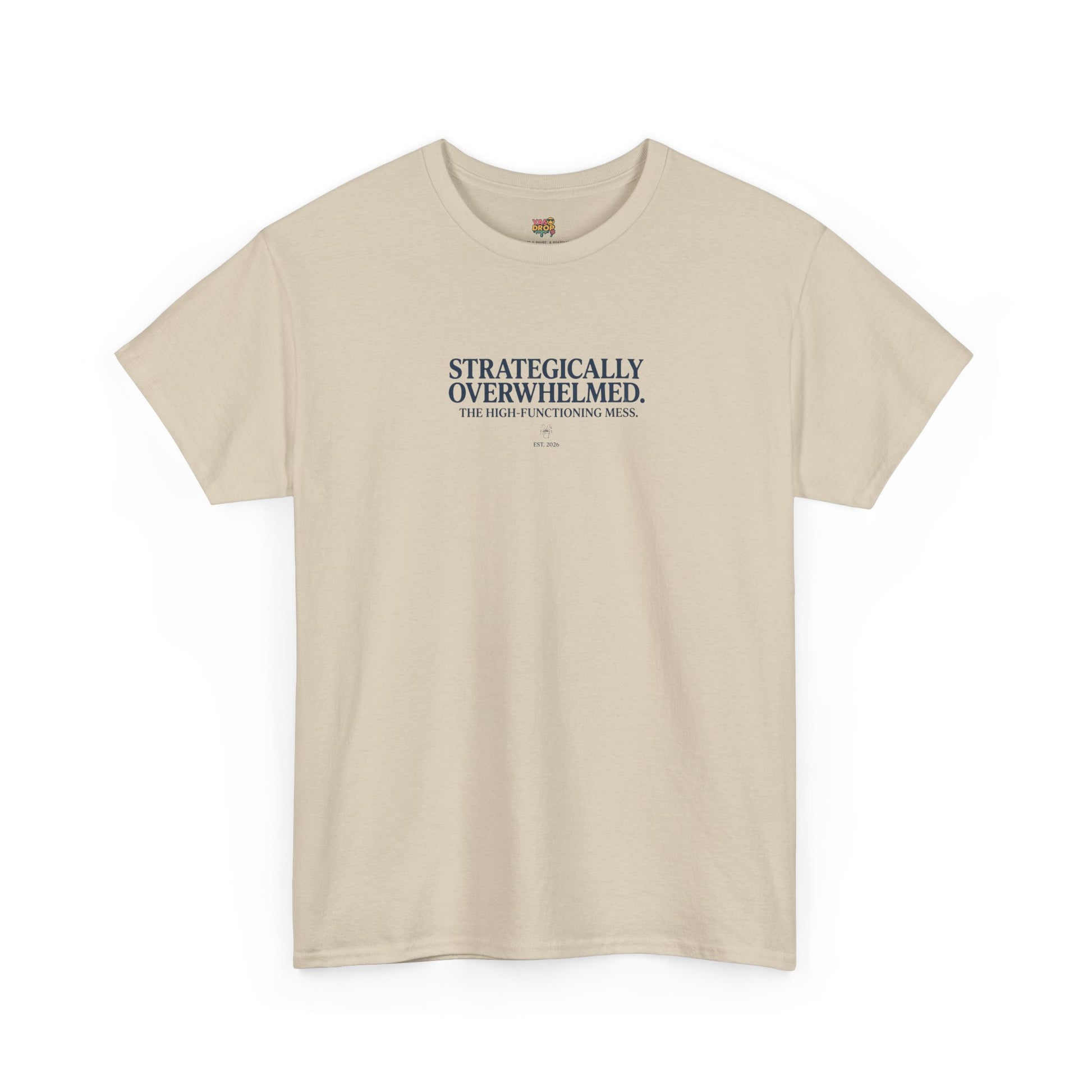 Beige t-shirt with text 'STRATEGICALLY OVERWHELMED. THE HIGHLY FUNCTIONING MESS.' on a white background